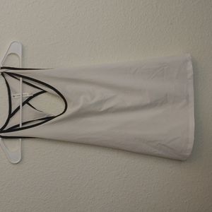 Fabletics white breezy workout tank with twist back.